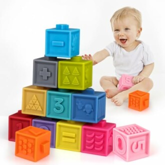 Baby playing with colorful educational blocks.