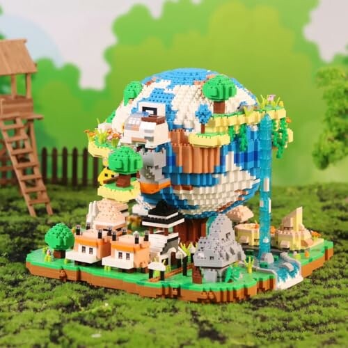 Block toy model of Earth with houses and landscape