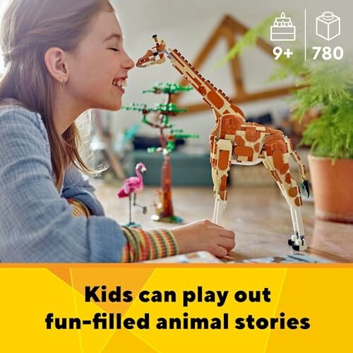 Child playing with a giraffe toy set on a table.