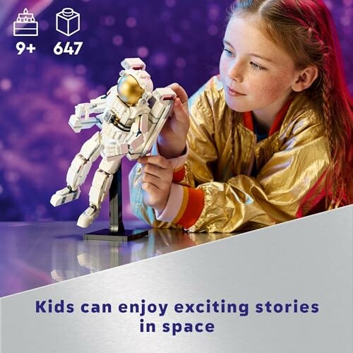 Child in gold jacket playing with space-themed toy.