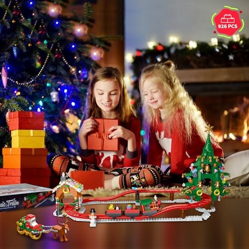 Two girls opening gifts near a Christmas tree with a LEGO set.