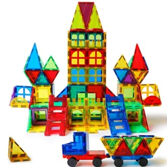 Colorful magnetic building tiles arranged in a castle and vehicle shape.