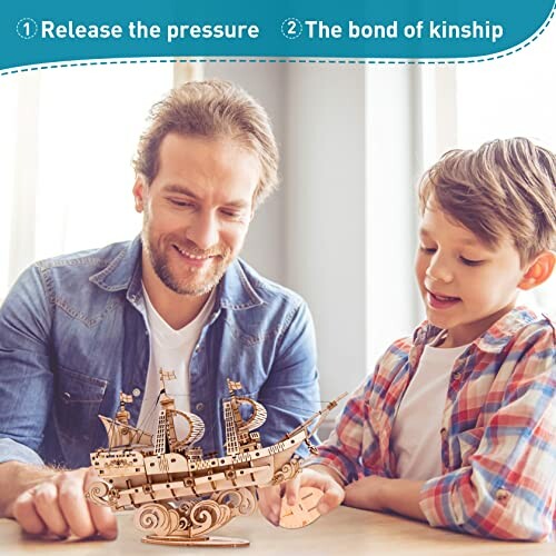 Father and son assembling a wooden ship model together.