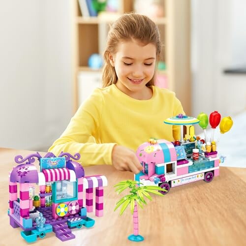 Girl playing with LEGO ice cream truck and shop set.