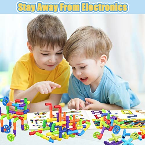 Two children playing with colorful building toys