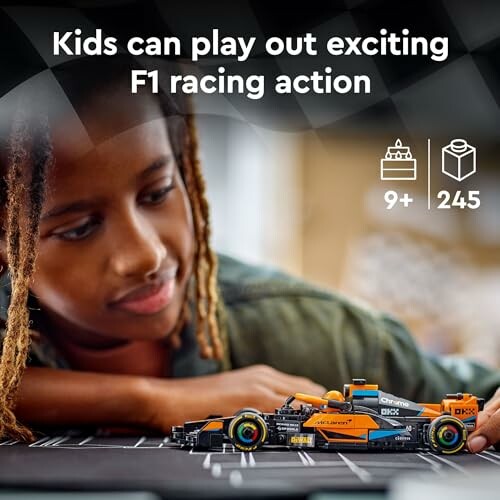 Child playing with a toy Formula 1 racing car set.