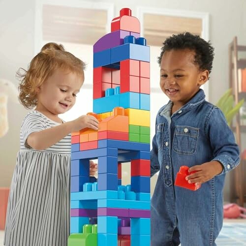 Two children playing with colorful building blocks.