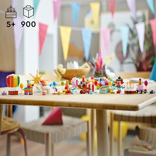 A colorful LEGO birthday party set on a table with decorations.