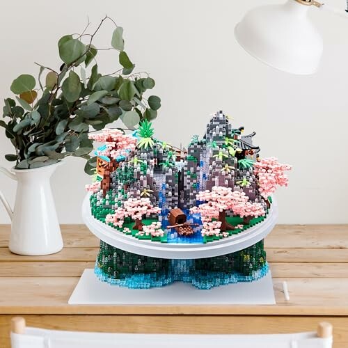 Lego diorama of a mountain scene with cherry blossoms.