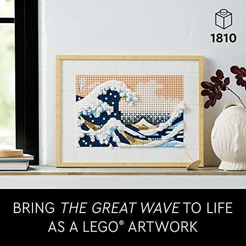 LEGO artwork of The Great Wave in a frame on a windowsill.