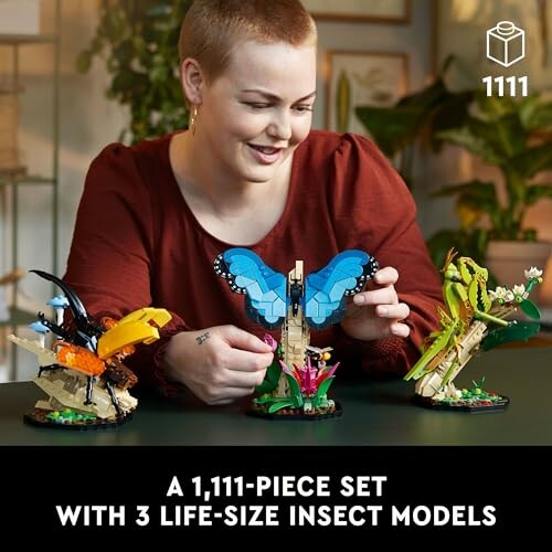 Person assembling LEGO insect models from a 1,111-piece set.