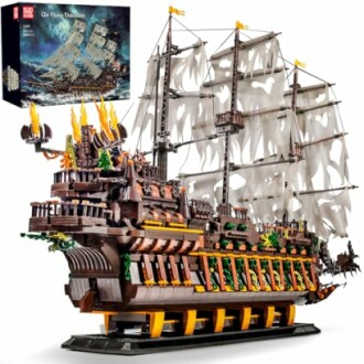 Intricate model ship building kit with sails and box packaging.