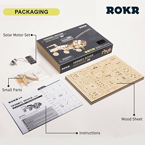 ROKR Hermes Rover packaging with solar motor set, small parts, wood sheet, and instructions.