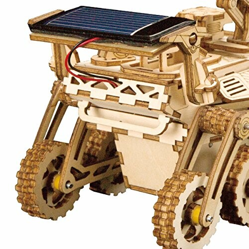 Wooden robotic vehicle with solar panel.