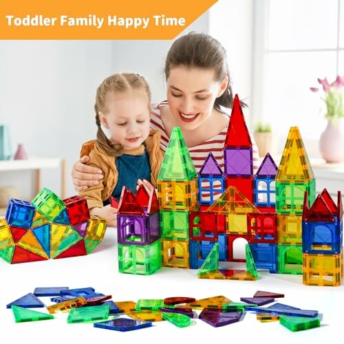 Mother and child playing with colorful magnetic building blocks.