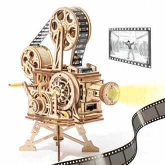 Wooden vintage film projector model with film strip