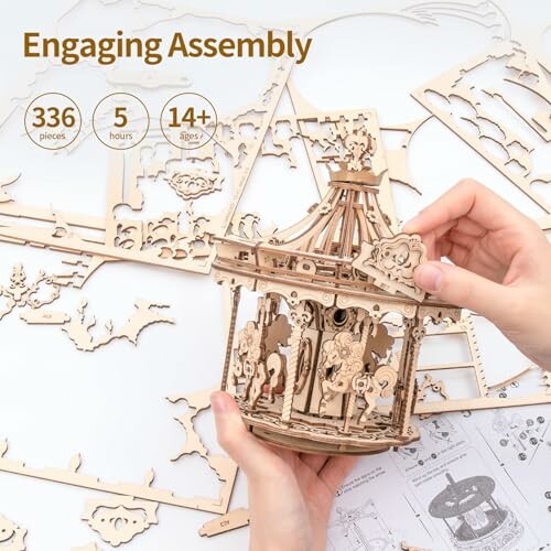 Hands assembling a wooden carousel puzzle kit with 336 pieces.