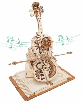 Intricate wooden violin puzzle model with gears on an open book.